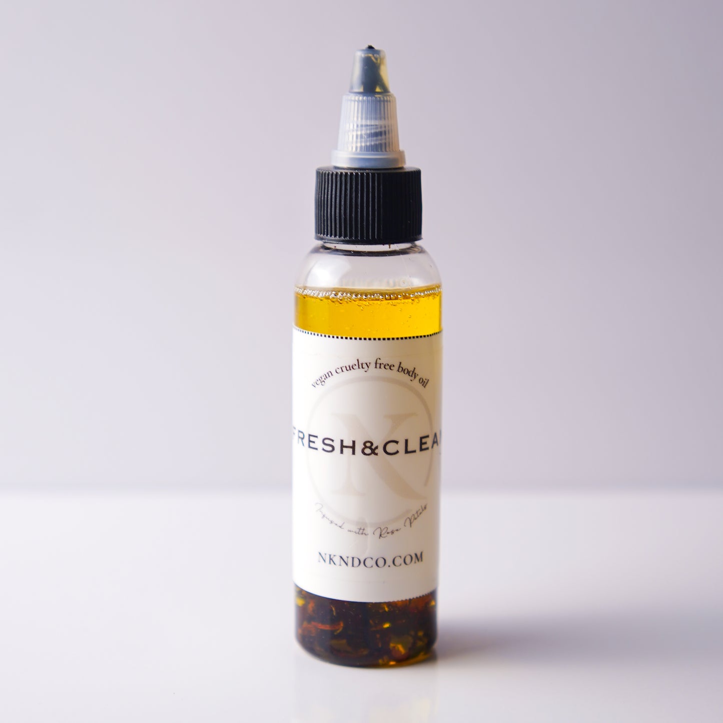 Bottle of 'Fresh & Clean' product on a white background