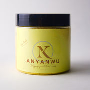 Yellow jar with black lid labeled NK&Co Anyanwu Hyperpigmentation Scrub on a white background