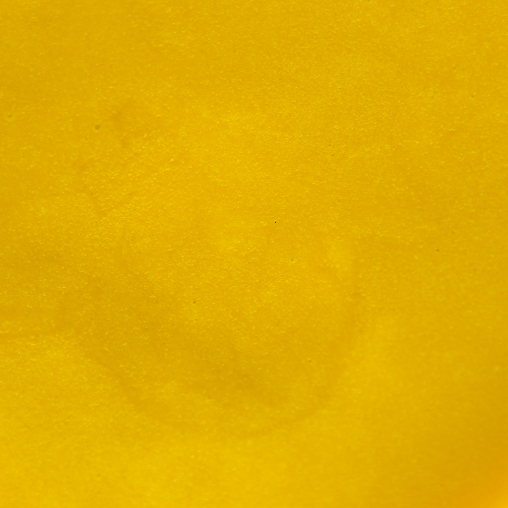 Close up image of solid mustard yellow color and texture of "Fure" Body Butta