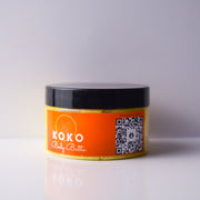 Jar of Koko Body Butter with orange label and black lid on a white background