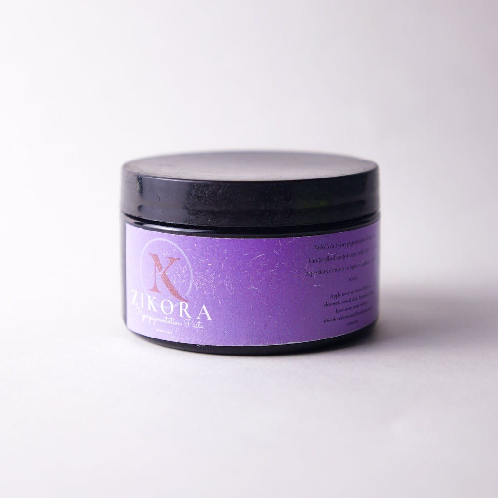 Purple jar with black lid labelled "ZIkora" Hyperpigmentation Paste on a white background