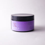 Purple jar with black lid labelled "ZIkora" Hyperpigmentation Paste on a white background