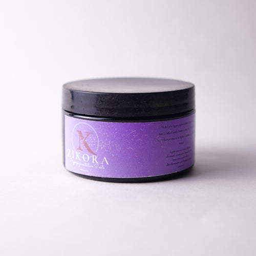 Purple jar with black lid labelled "ZIkora" Hyperpigmentation Paste on a white background