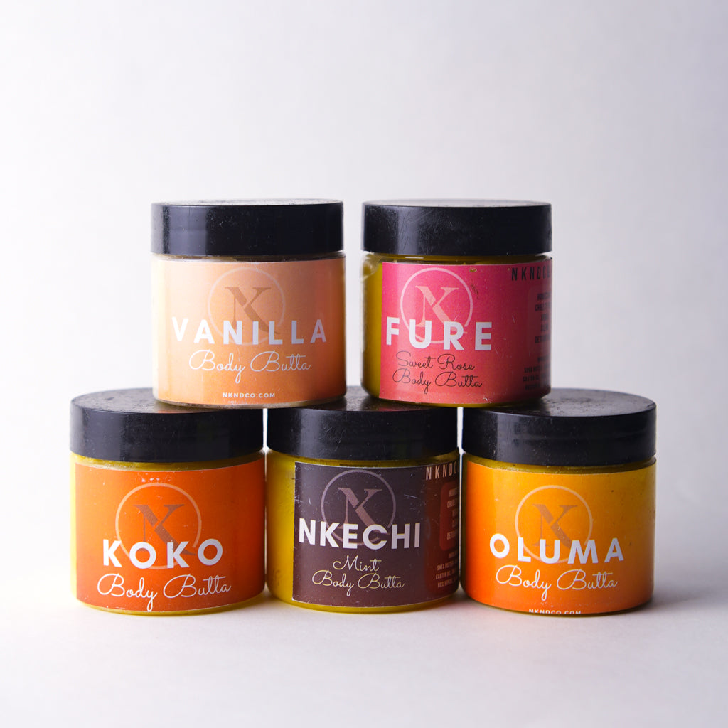 Five jars of Koko Body Butter in different flavors on a white background
