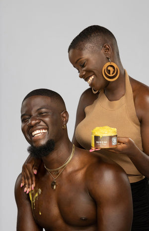 "Nkechi" Body Butter is being applied on the body